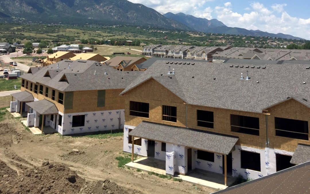 under construction houses with grey roofs