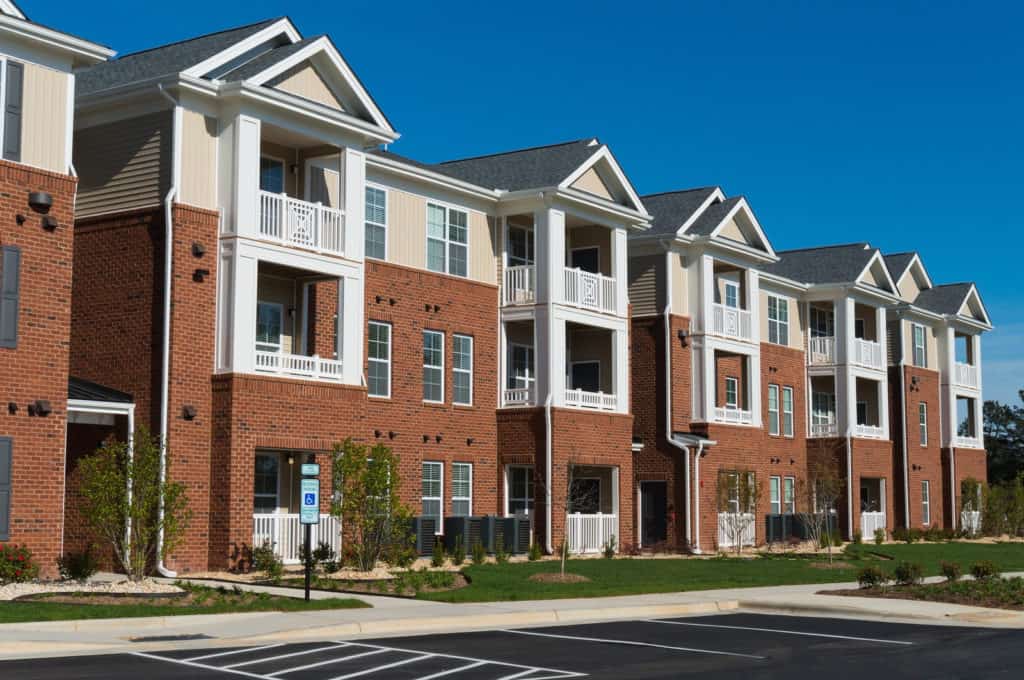 Row of multi family homes with new roofs from CWC