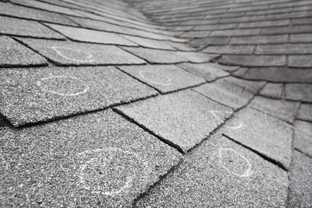 Old roof with chalk circling hail damage