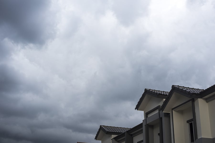 spanish tile roof with stormy cloud background