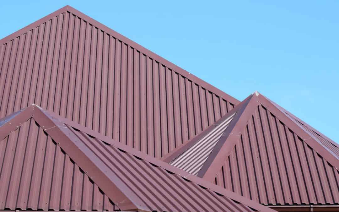 a bright maroon metal roof on a home